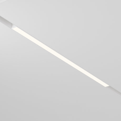 A modern ceiling incorporates the Basis LED Linear Light for Magnetic Track Exility 24W 3000K - White, offering a warm ambient glow embedded in a white surface, delivering a clean and minimalist look to the space.