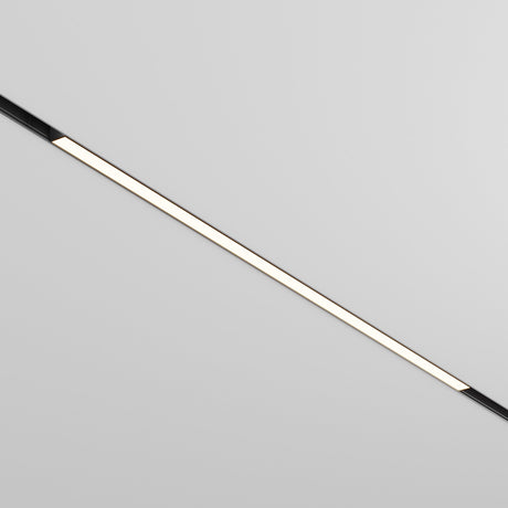 The Basis DALI CCT LED Dimmable Linear Track Light for Magnetic Exility, 30W 2700-6000K with sleek black trim, is mounted on a plain white ceiling. When turned on, it emits a soft glow along its length, enhancing the minimalist modern decor of the space.
