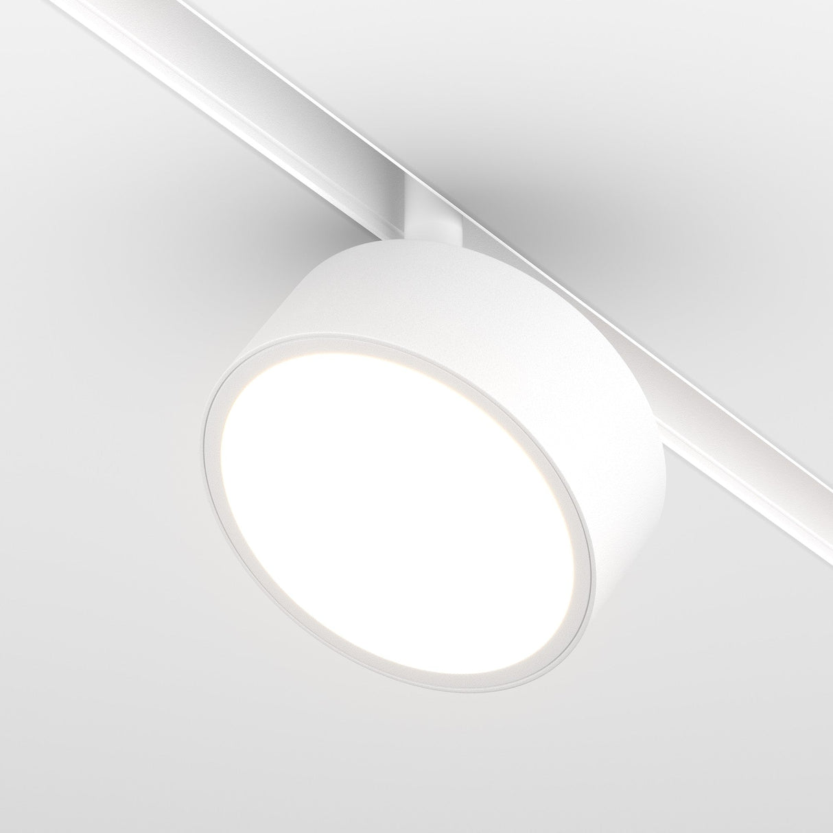 A close-up of the Rado LED Magnetic Exility Track Spotlight (18W, 3000K) showcases its illuminated, even glow. The white frame and sleek track blend effortlessly with the ceiling for energy-efficient lighting.