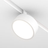 A close-up of the Rado LED Magnetic Exility Track Spotlight (18W, 3000K) showcases its illuminated, even glow. The white frame and sleek track blend effortlessly with the ceiling for energy-efficient lighting.