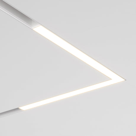 The Basis Angle LED Corner Linear Track Light for Magnetic Exility 24W 3000K enhances minimalist interiors with its sleek V-shaped design and bright white lighting, offering a modern touch against a plain ceiling.