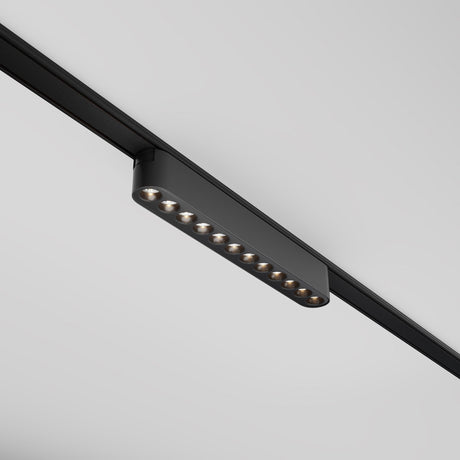 The Points LED Linear Track Light for Magnetic Tracks Radity 12W 3000K in black is a modern, minimalist design with ten small, evenly spaced bulbs that mount on ceiling rails. Its perfect for accent lighting and offers easy adjustment through its magnetic track system.