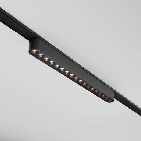 The Points LED Linear Track Light for Magnetic Tracks Radity, a 16W fixture in black, features small aligned bulbs on a white ceiling. Its minimalist design and 3000K color temperature offer a sleek, sophisticated look.