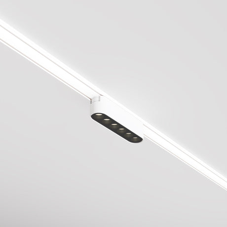 The Points LED Linear Track Light by Radity is a sleek and modern 6W fixture with magnetic tracks, featuring a white exterior and black circular components, mounted on a white ceiling. Its minimalistic design offers a streamlined and contemporary aesthetic perfect for any space.