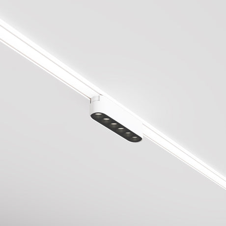 The Points LED Linear Track Light for Magnetic Tracks Radity, offering a 6W power and 4000K color temperature, features a sleek white design with five recessed circular lights mounted on a white ceiling, ideal for minimalist interiors.