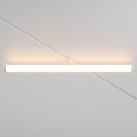 The Larc LED Rotating Linear Track Light for Magnetic Exility (25W, 3000K) emits a warm glow from the white ceiling, casting soft shadows and diagonal lines across the surface with its minimalist cylindrical design.