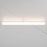 The Larc LED Rotating Linear Track Light, 25W 4000K in white, features a sleek horizontal tube design with energy-efficient LED technology. It is set against a subtly patterned white ceiling and casts a soft glow on the surrounding surface.