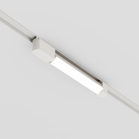 The Basis Rot LED Swivel Linear Track Light, 12W and 4000K, offers sleek directional lighting with its minimalist modern design on a white ceiling.