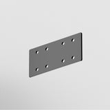 The S35 Magnetic Track Straight Connector - Silver is a rectangular metal plate with rounded corners and eight equidistant holes in two rows. Its brilliant shine against a plain white background reflects the elegance of seamless connection in industrial design.