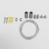 The S35 Magnetic Surface-Mounted Track Suspension Cable - Silver, ideal for 48V track lighting systems, includes white wall-mounting hardware with screws, yellow plugs, metal caps, cylindrical connectors, and a coiled silver wire.