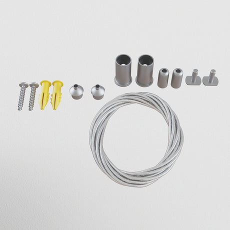 The S35 Magnetic Surface-Mounted Track Suspension Cable - Silver, ideal for 48V track lighting systems, includes white wall-mounting hardware with screws, yellow plugs, metal caps, cylindrical connectors, and a coiled silver wire.