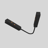 The Exility Track Flexible Corner Power Connector - Black is shown as a black, rectangular hinge-like device with orange connectors and two cable-joined segments, ideal for modern interiors on a plain grey background, seamlessly connecting components.
