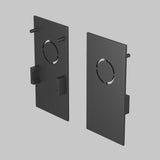 A pair of black rectangular Exility Magnetic Surface-Mounted Track End Caps with central circular cutouts and side tabs, set against a light gray background, are perfect connectors or mounts to enhance track lighting with their sleek finish.