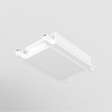 The modern, white ceiling light fixture, featuring a Radity Magnetic Track Straight Power Connector, is mounted on a smooth ceiling. Its minimalist design showcases clean lines and a slightly recessed center panel for versatile lighting configurations.