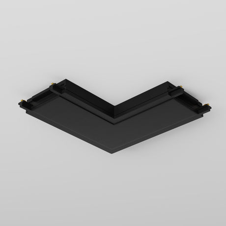 A black, V-shaped L-shaped power connector with a sleek design against a light gray background, featuring a flat top surface and small gold connectors on each end, reminiscent of the Radity Magnetic Track Lighting Series.