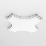 The Radity Magnetic Track X-Shaped Power Connector in white features a geometric, square design with rounded corners, integrating effortlessly into diverse lighting setups and blending seamlessly with the ceiling.