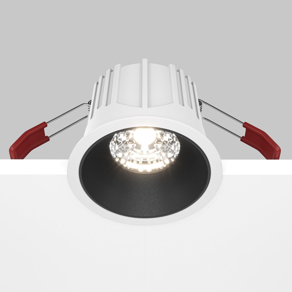 Alfa LED recessed downlight with mobility and control features in white and black, designed for enhanced lighting flexibility