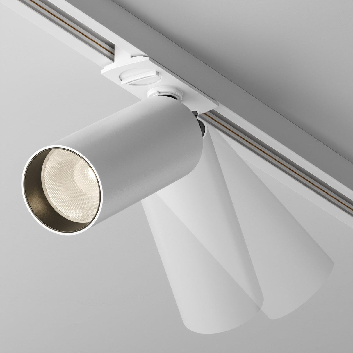 Control and mobility features of Focus LED single phase Unity track spotlight in white, perfect for adaptable lighting installations.