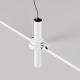 The Focus T LED Adjustable Short Retractable In-Out Recessed Downlight 7W 3000K in white features a minimalist cylindrical design with energy efficiency, suspended from a light gray ceiling. Its sleek style includes a contrasting black cable at the top, offering subtle sophistication.