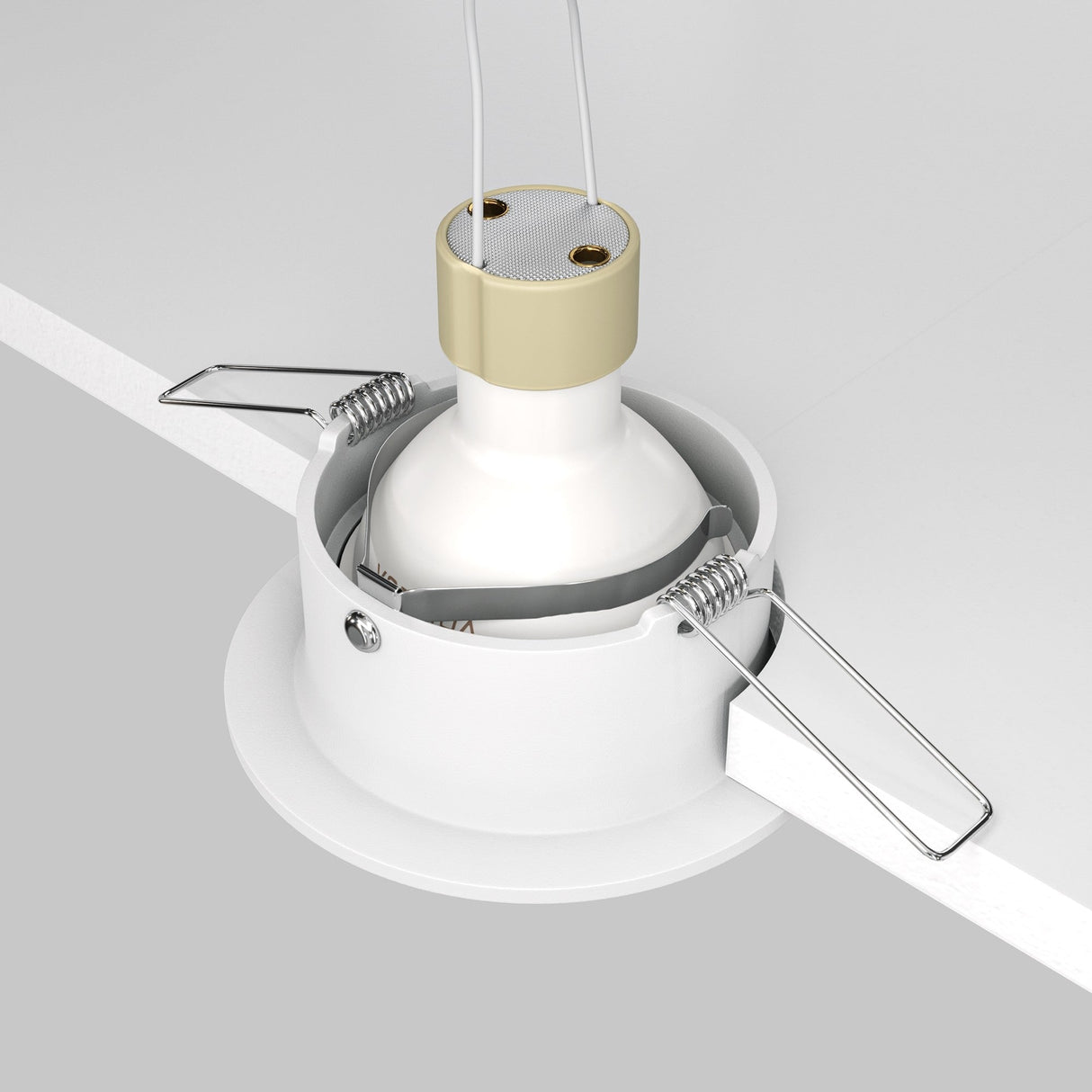 The Slim Fixed Round Recessed Downlight in white features a gold and white cylindrical design with spring-loaded clips for easy installation, offering a minimalist lighting solution partially set in a white ceiling for an elegant room accent.