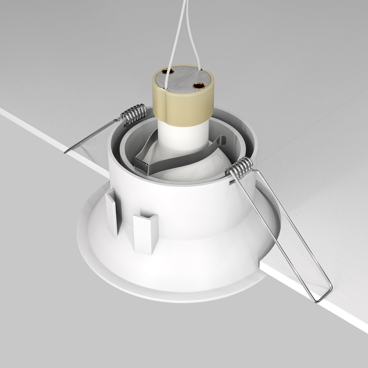 A close-up shows the Dot Single Tilt Round Recessed Downlight - White being installed. The fixture features metal spring clips for secure installation, an adjustable tilt, and two wires extending from the top. The ceiling is cut away to reveal its energy-efficient design.