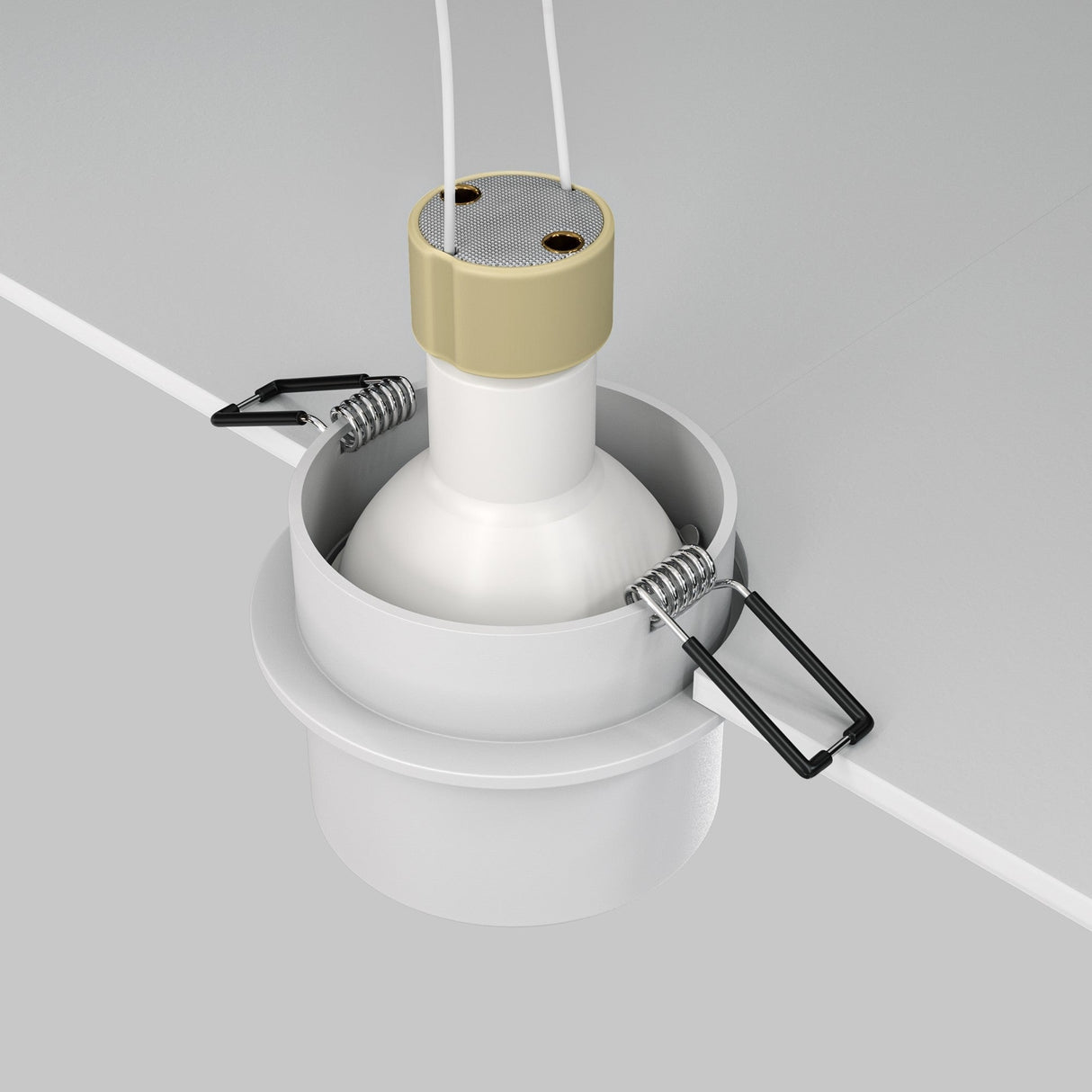 Close-up of the Reif Round Recessed Downlight With Extended Rim - White, featuring a cylindrical white body and beige top. Partially inserted rim displays metal spring clips for installation and two white wires extend from the top, set against a light gray background, ideal for modern interiors.