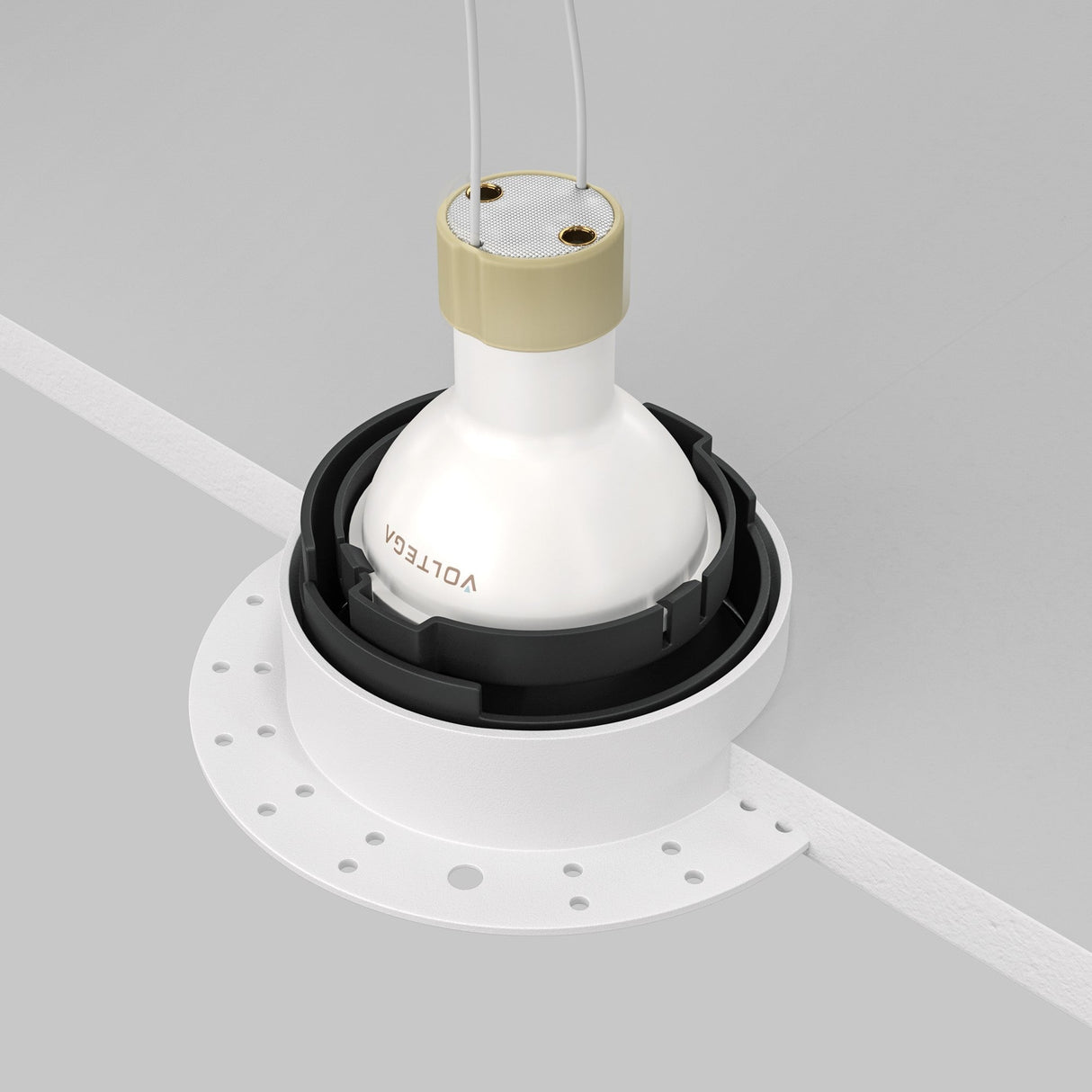 A white and beige VOLTGE ceiling light fixture, designed for plaster-in installation, is partially recessed into a circular ceiling mount with two visible wires. The Share Round Plaster-in Recessed Swivel Downlight - White & Black rests against a smooth, light gray ceiling.
