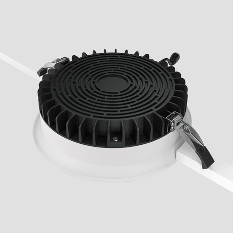 Mounting components of Okno LED Round Recessed Downlight in White, designed for effortless installation in recessed configurations.