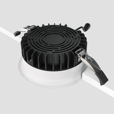Mounting components for Okno LED Round Recessed Downlight in white, showing ease of installation and flexible usage