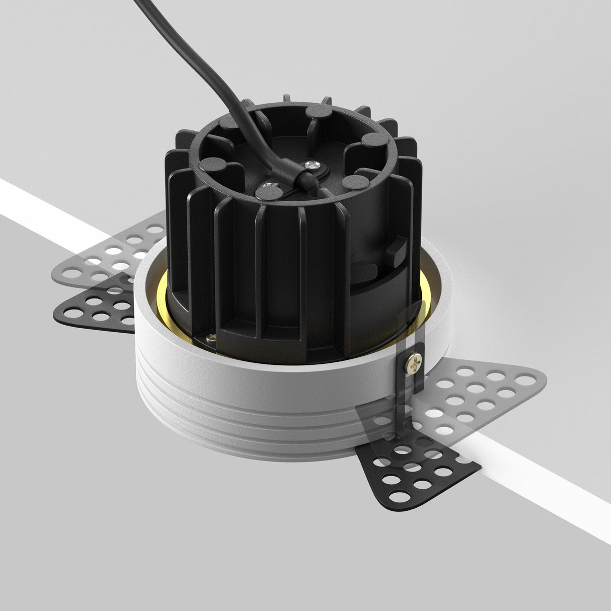 Mounting components for round LED recessed trimless downlight in brass, ensuring a secure and integrated installation.
