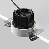 Mounting components for round LED recessed trimless downlight in brass, ensuring a secure and integrated installation.