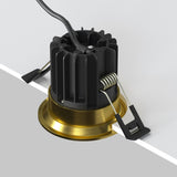 Mounting components for round LED recessed downlight in brass, suitable for a seamless look in modern settings.