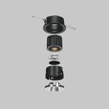An exploded view of the Wise Downlight Round Honeycomb Light Filter 26mm in black shows its components on a gray background. From top to bottom, the alignment includes outer casing, LED module, lens, heat sink, and reflective trim for glare reduction.