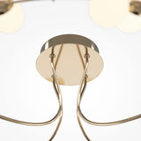 Close-up of the Tessara LED Semi-Flush Light 3000K 55W with a circular metallic base and elegant, curved rods extending downwards. Its minimalist design features an energy-efficient, gold finish, set against a bright, clean background.