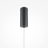 The Halo Dimmable LED Short Slim Pendant Light hangs from the ceiling with a thin black cord. The energy-efficient light is turned off, and the plain white background enhances its minimalist appearance.
