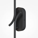Close-up of the Renaissance LED Wall Light - Black, featuring a sleek vertical rod design and energy-efficient lighting. It boasts a rounded base with two curved prongs and a black finish against a plain white background.