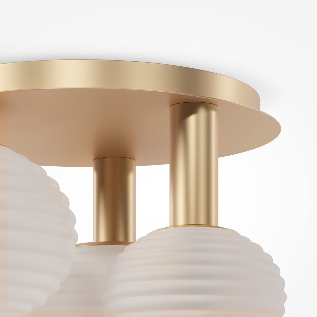 A close-up of the Reels 3 Light Semi-Flush in gold reveals a modern matte finish with three cylindrical supports. Two ribbed, frosted glass globes hang below, offering an elegant and contemporary feel to this luxurious lighting fixture.