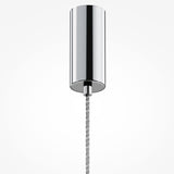 Close-up of the Ordo LED Long Pendant Light in chrome, featuring a sleek cylindrical design and clear glass, suspended by a thin braided metal cord against a plain white background.