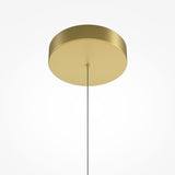 The Radiance LED Suspension Light - Gold features a minimalistic design with a round satin brass ceiling canopy and a sleek silver cord, all set against a plain white backdrop.