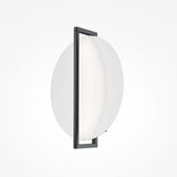 The Mira LED Wall Light features a minimalist design with a black metal frame and a circular white diffuser, providing ambient lighting mounted on a plain white background.