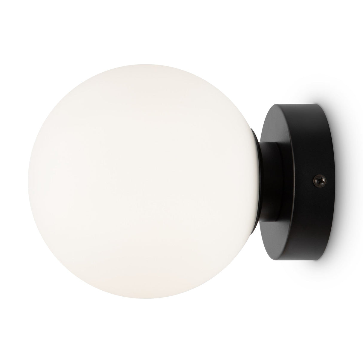 The Basic form Small Frosted Ball Wall Light in black features a frosted glass globe and sleek round base, adding sophistication to any space.