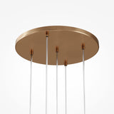 The Basic Form 5 Light Cluster Pendant in gold features a modern, minimalist design with five thin rods and smooth metallic surfaces. Its contemporary style is highlighted against a plain white background.