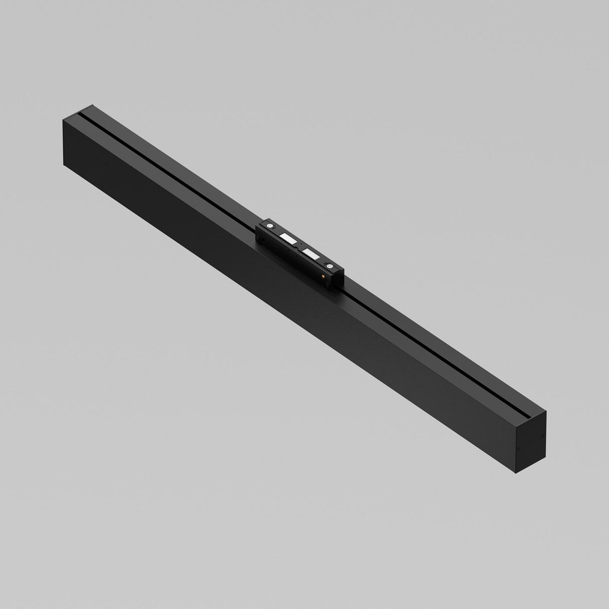 The Basis LED Linear Track Light for Magnetic S35, featuring a sleek black rectangular design with minimal buttons, is set against a plain, light background.