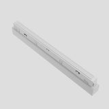 A slim, rectangular Basis CCT LED Dimmable Linear Track Light for Magnetic Exility with a white finish, featuring multiple grooves and ports on its side, set against a plain light gray background.