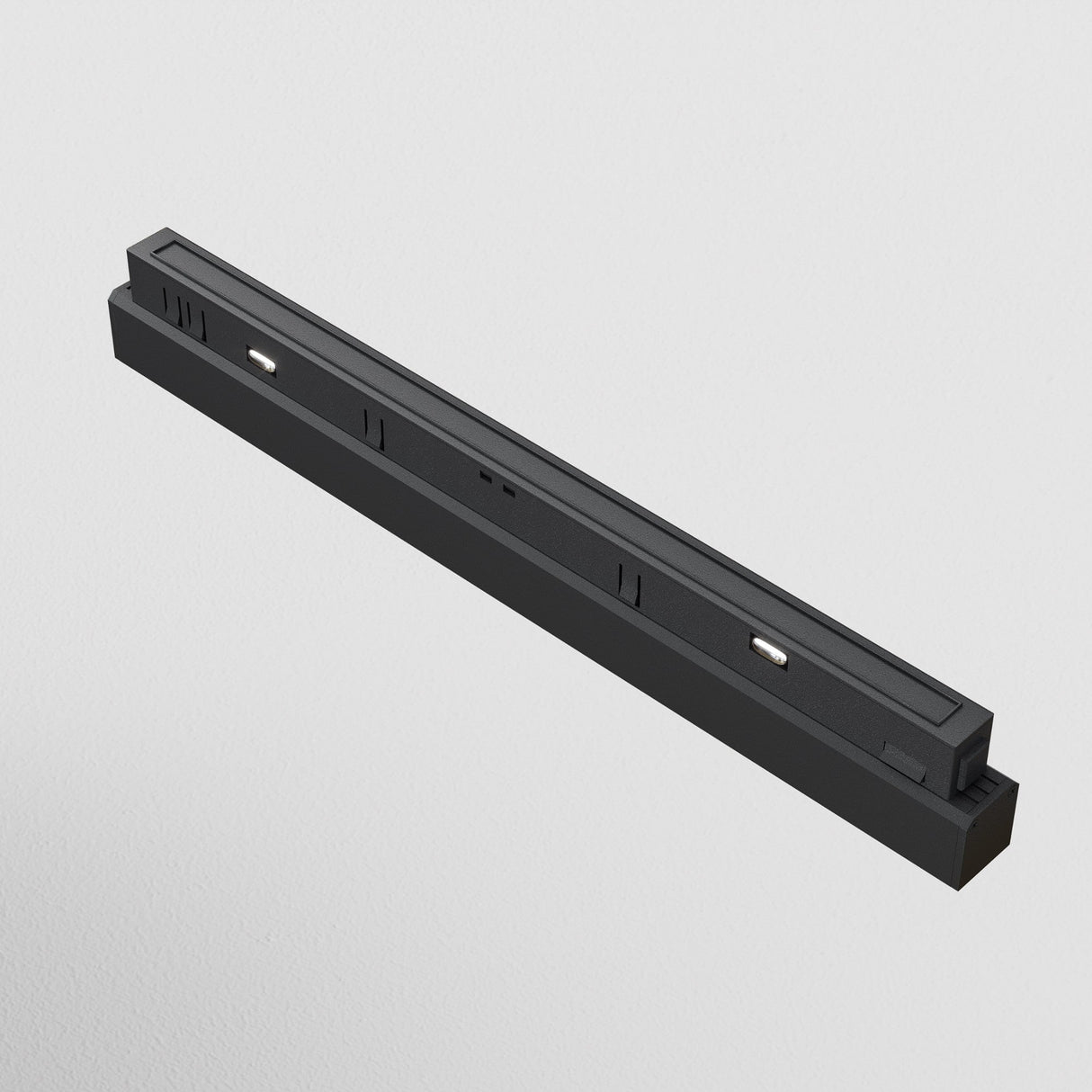 The Points LED Linear Track Light for Magnetic Exility, 18W 4000K Black, is a rectangular electronic device with two metallic connector pins, designed for wall mounting and featuring energy-efficient LED technology against a white background.