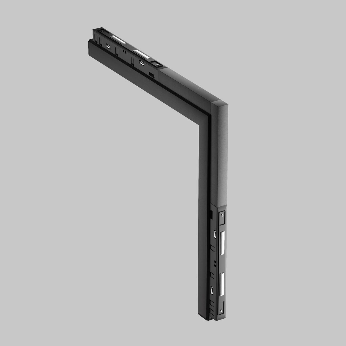 The Basis LED 90° Linear Track Light for Magnetic Exility in black features a sleek, minimalist design with visible buttons and ports, set against a light gray background, giving it a modern tech device appearance.