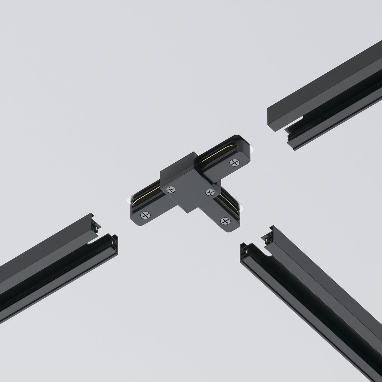 A Unity Single Phase Surface-Mounted Track T-Connector in black joins four rail segments against a light gray background, featuring visible screws that suggest its use in modular track lighting systems.