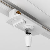 Close-up of a Unity Single Phase Track Connector in white, ceiling-mounted with an elegant pull cord. The modular unit includes a circular control knob and spring mechanism, and its ridged handle complements the light ceiling beautifully.