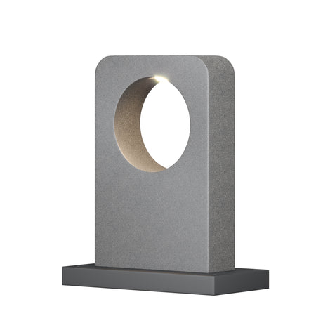 Maytoni Betone LED bollard light with textured cement body, oval cut-out aperture emitting warm white light, and dark grey aluminium base.