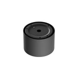 Resembling the Vega LED Round Surface Downlight 8W 3000K - Black, a black cylindrical speaker features a circular top with small holes and a central larger one, boasting a sleek, smooth surface that enhances its minimalist, modern design akin to the downlights understated elegance.